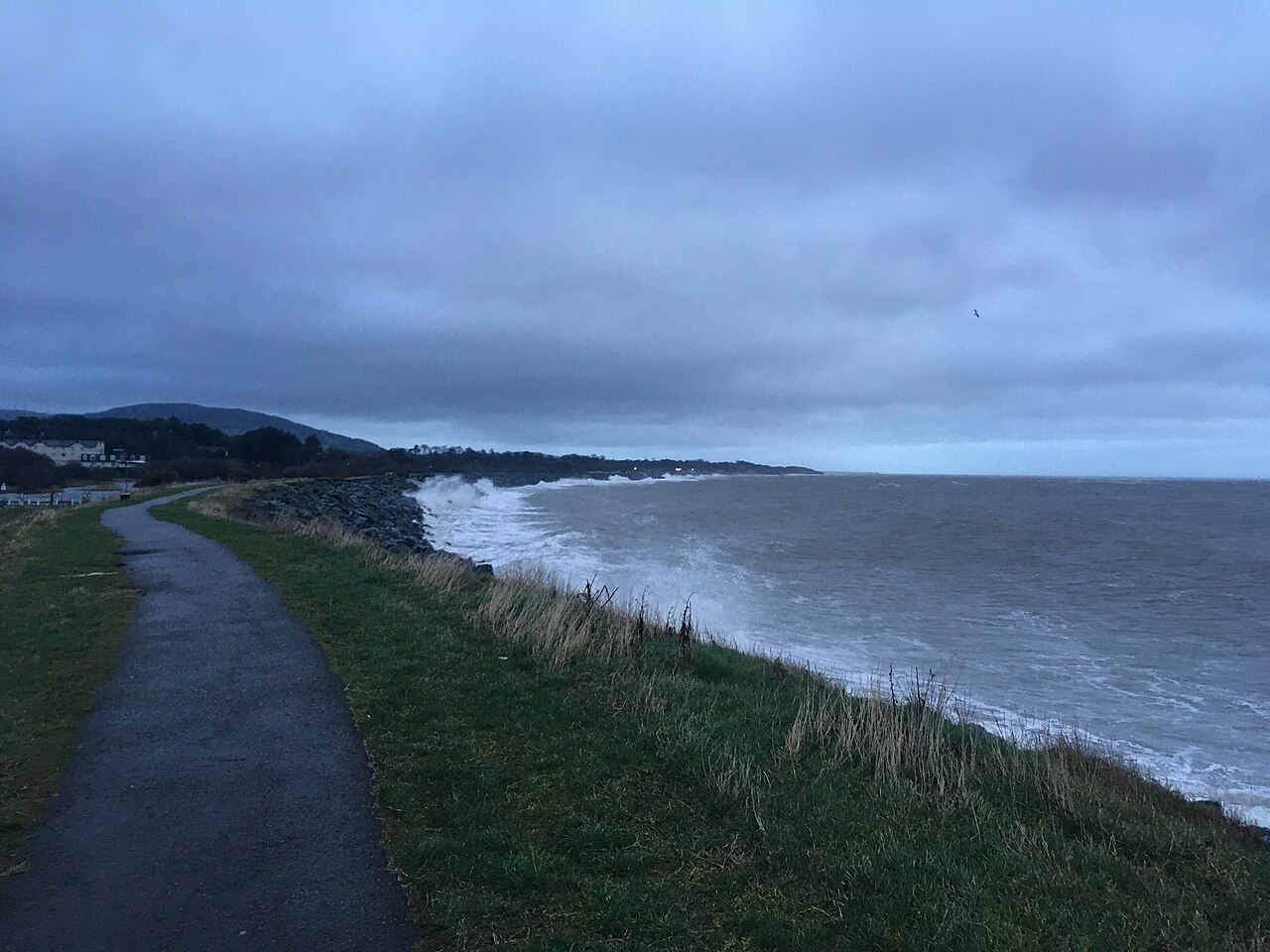 Waves strike a coastal revetment in County Wicklow, Ireland.