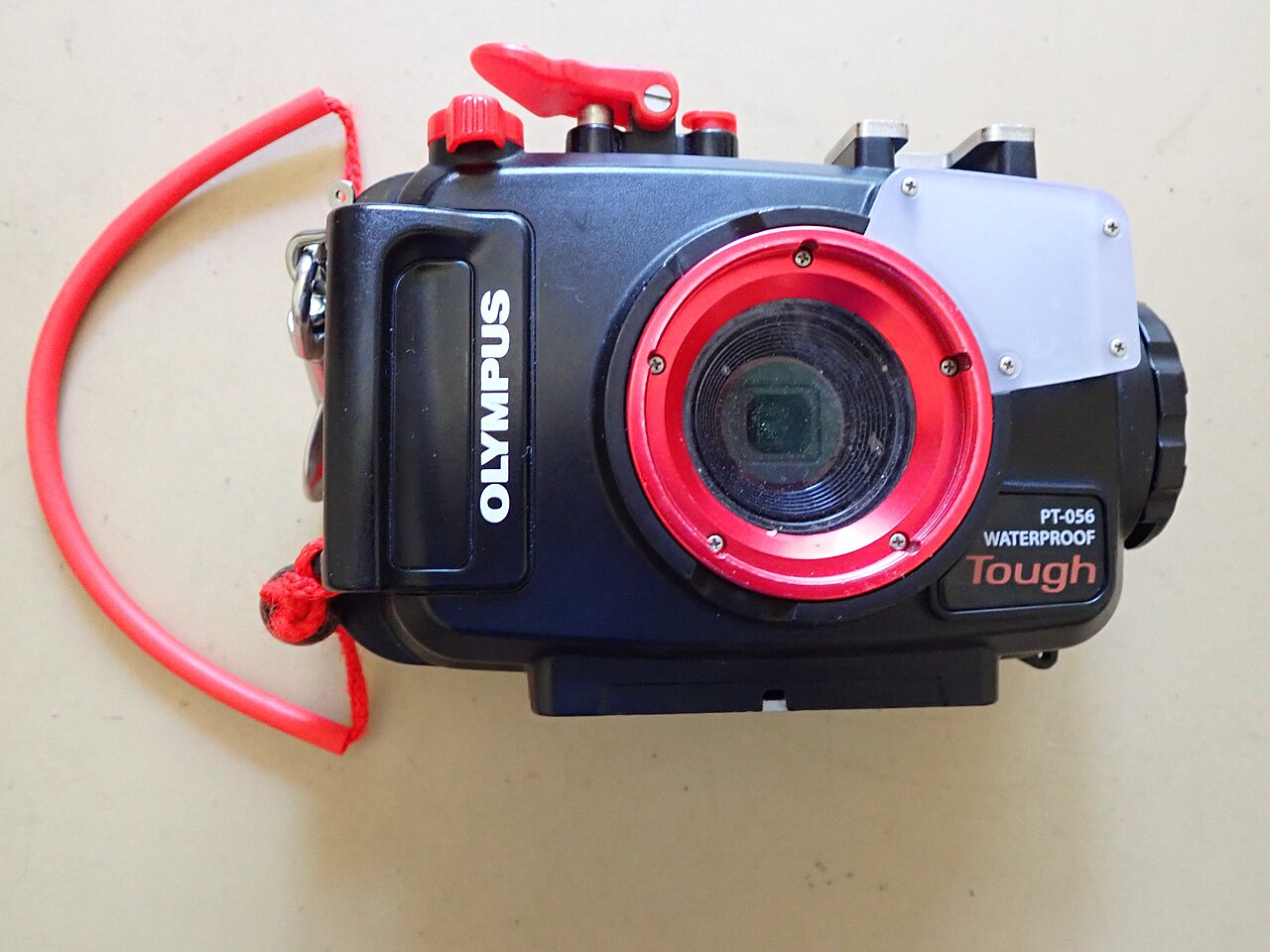 Front view of an Olympus TG-3 camera in its underwater housing