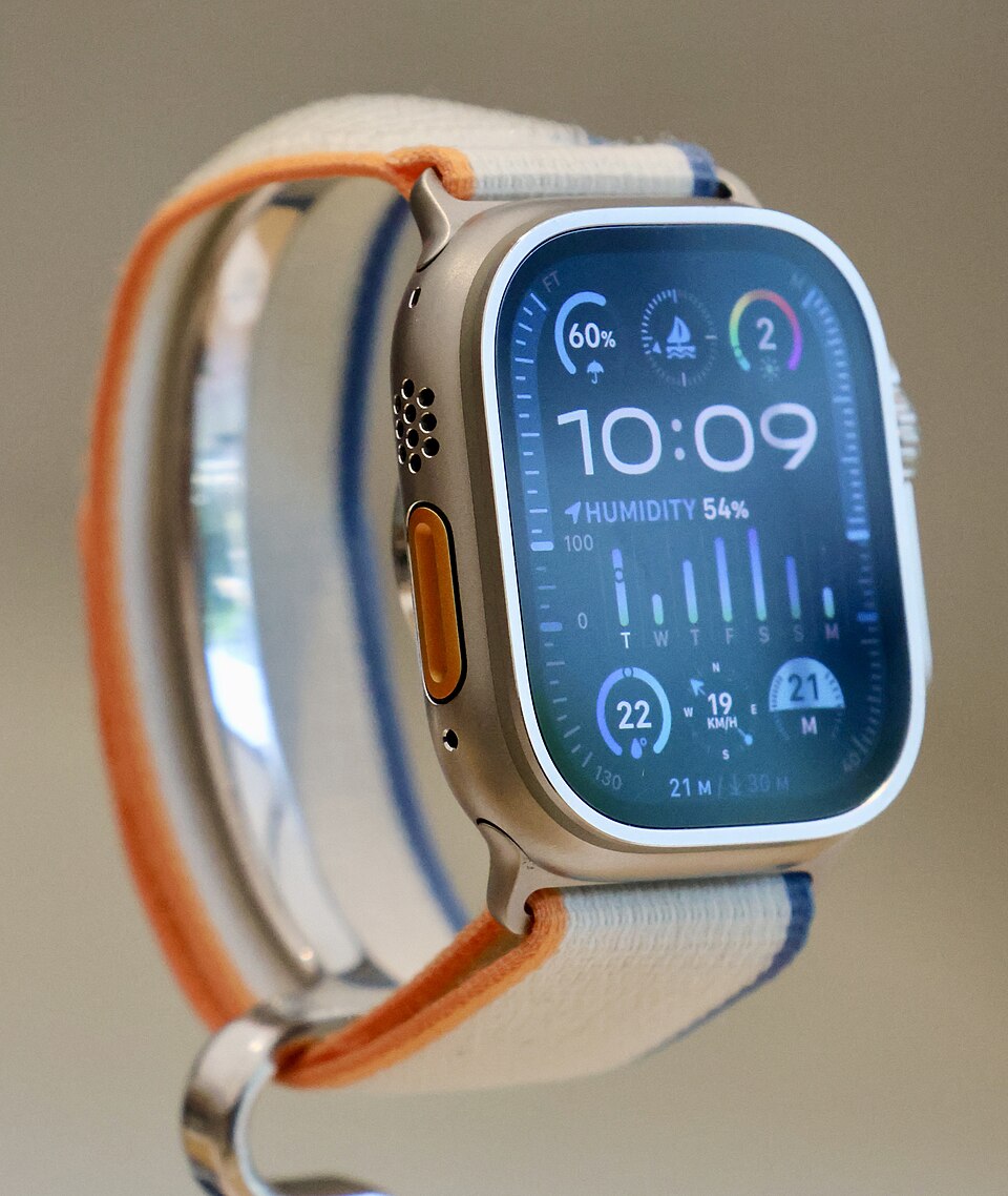 Apple Watch Ultra 2 on a retail display stand, showing a standard watch face rather than WatchDive software