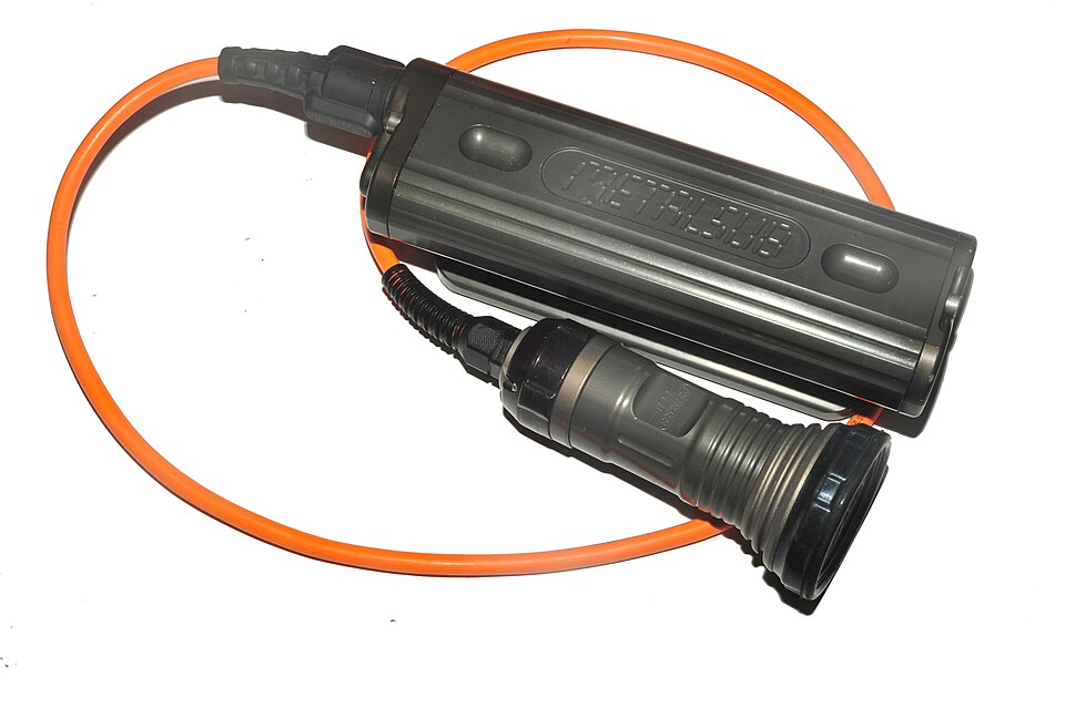 Historical Metalsub umbilical dive torch with a separate battery canister and light head