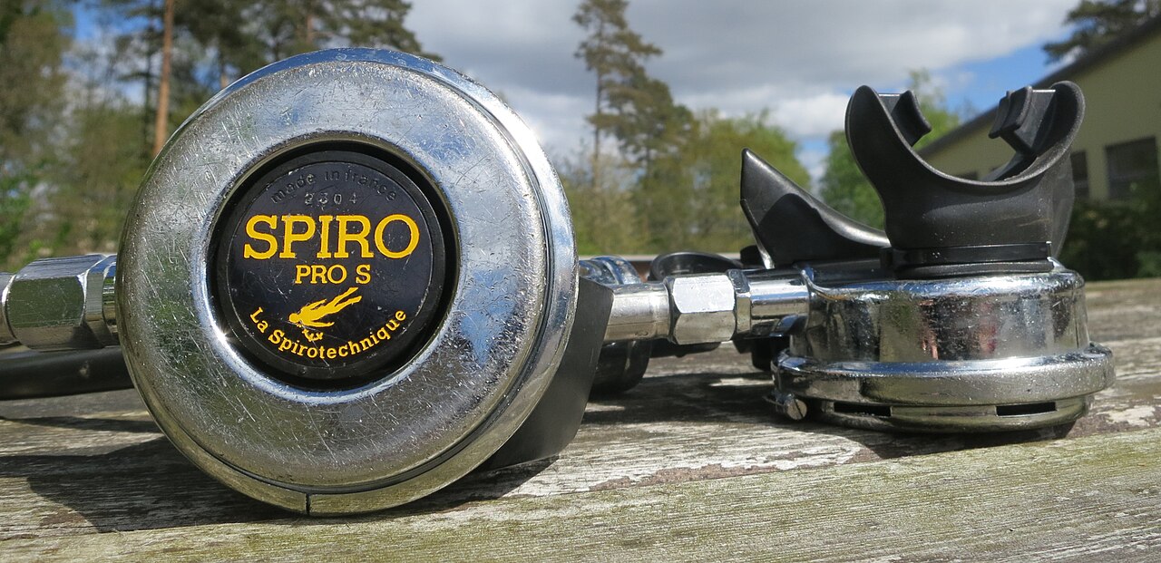 Historical La Spirotechnique Spiro Pro S regulator components on a wooden surface