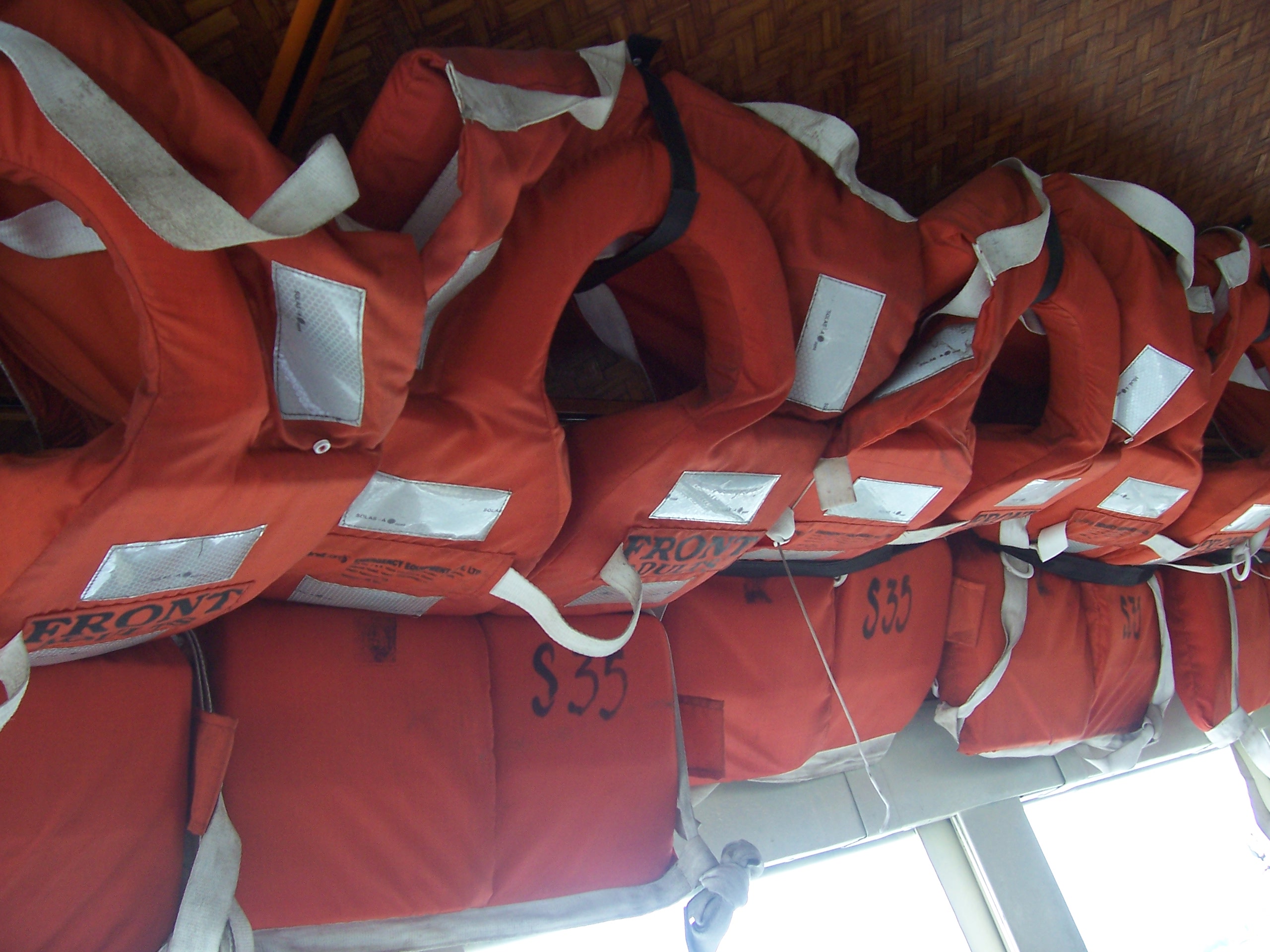 Orange flotation devices stored aboard a boat in Kochi, India