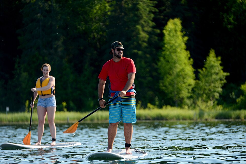 Two adult paddleboarders during an Otter Lake class