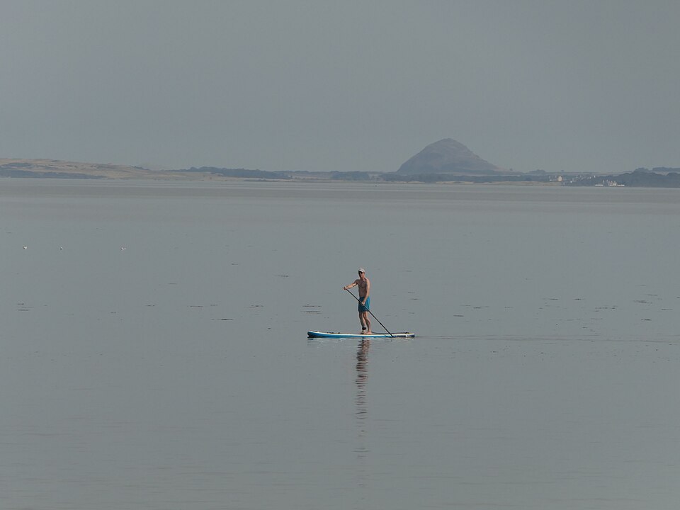 Distant stand-up paddler off Portobello