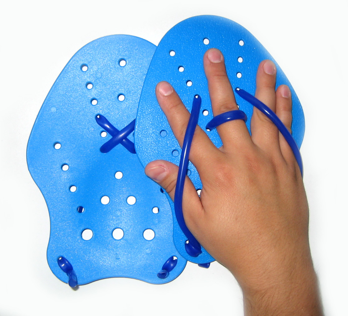 Archive photograph showing a hand resting in the straps of a blue swim paddle.