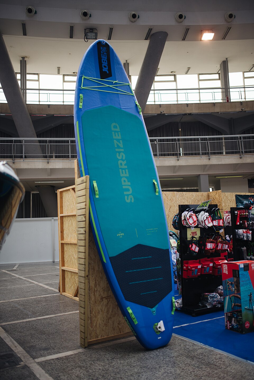 Inflatable paddleboard displayed at a sports expo