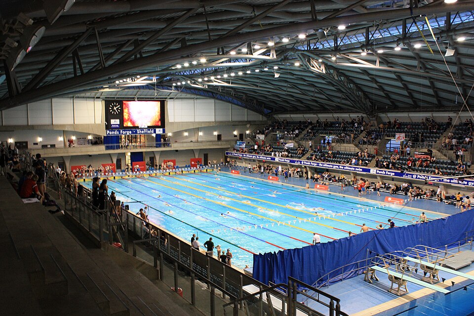 Archive wide view of the competition pool and spectator stands inside Ponds Forge.