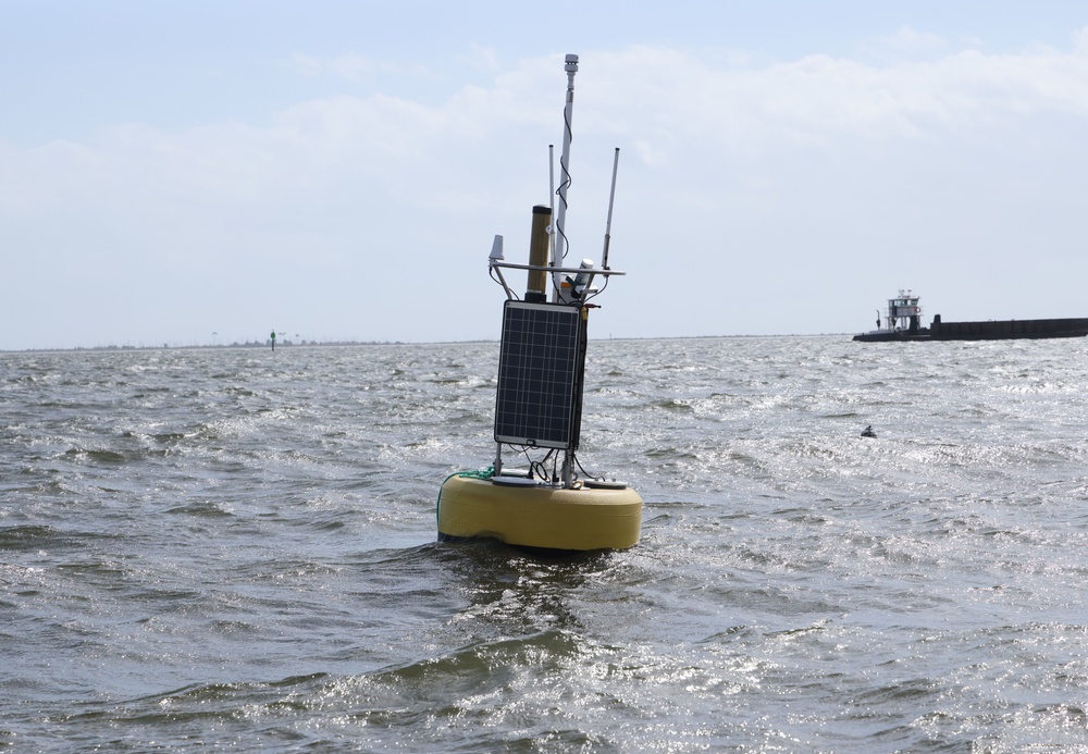 Archive photograph of an ocean-observation buoy with a solar panel floating in Biloxi Bay.