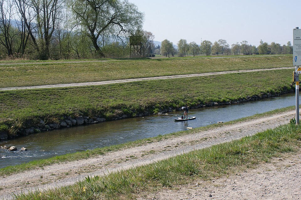 Distant paddleboarder on the Dornbirner Ach in Austria
