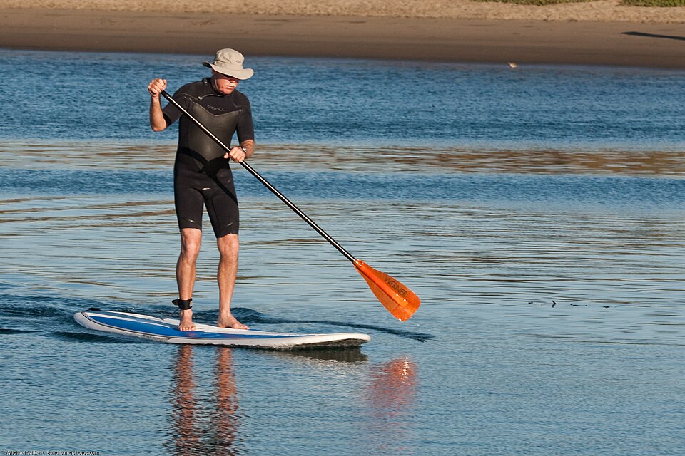 Adult paddleboarder in Morro Bay harbor in California