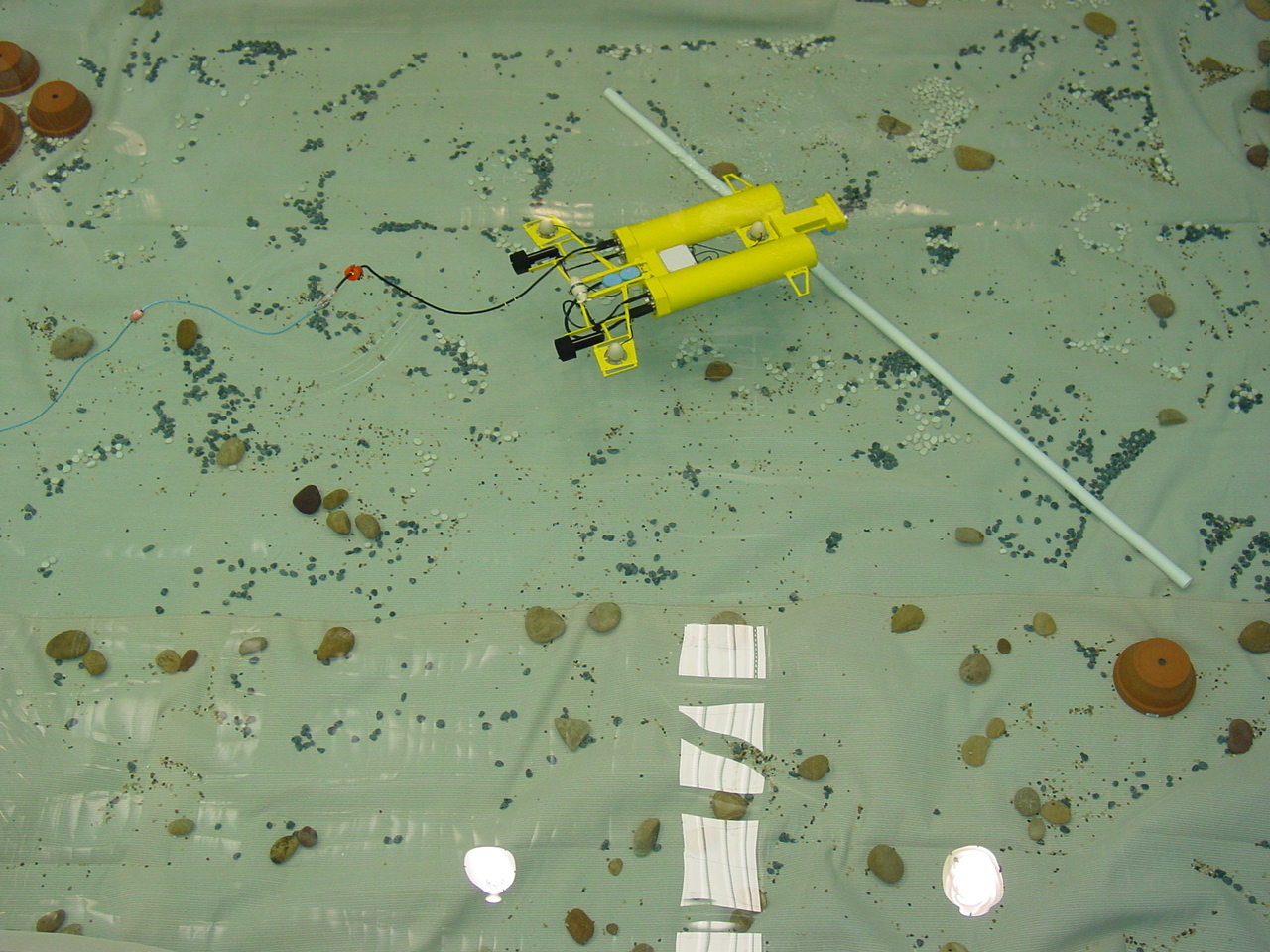 Archived overhead photograph of the yellow CSIRO Starbug research vehicle in a test pool; not the BlueROV2 from the new paper.